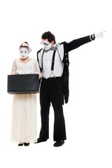 studio shot of mimes with suitcase