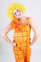 Portrait of funny clown with bow