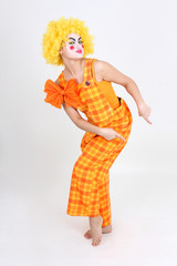 Funny dancing clown in costume