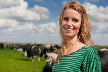 Dutch girl in field with cows