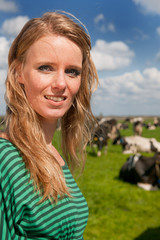 Dutch girl in field with cows