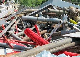 pipes and irons in a landfill of old iron