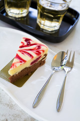 Strawberry cheesecake on white plate