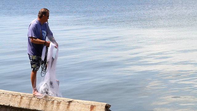 Man Casting Seine Net