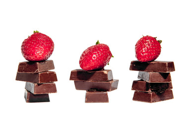 Fresh strawberries and chocolate bars isolated