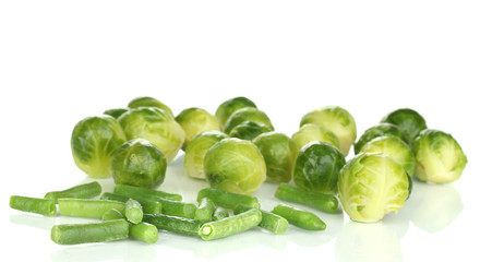 Fresh brussels sprouts and french bean isolated on white