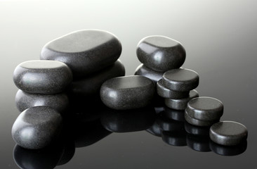 Spa stones on grey background