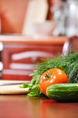 ripe vegetables is liying on table in kitchen