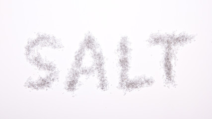 The word salt spelled out on a grey background