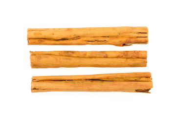 Three cinnamon sticks isolated on white background