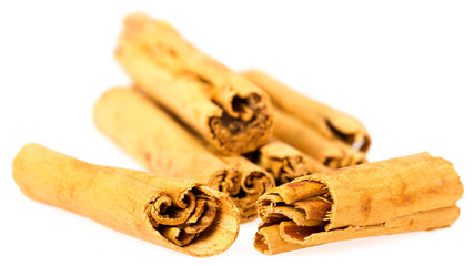 Six cinnamon sticks isolated on white background