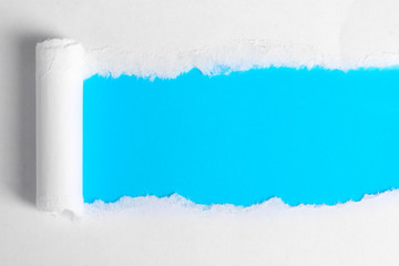 Torn paper  with blue background
