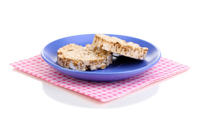 Bread snacks on saucer with napkin isolated on white