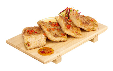 Fried fish fillets with  salad.
