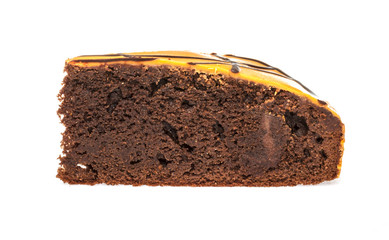 Piece of chocolate cake with icing on white isolated background