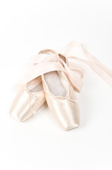 A pair of dainty pink ballet shoes