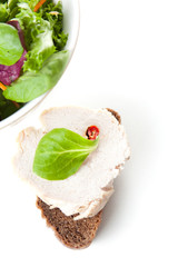 Serving of fresh green salad and bread