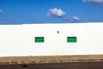 Obraz premium facade of mediterranean house with closed shutterblinds