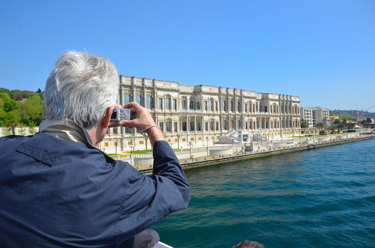 Man photographing landscape with digital photo camera