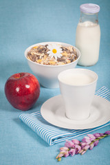 Healthy nutrition with fresh milk and a red apple.