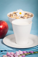 Healthy nutrition with fresh milk and a red apple.