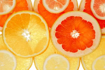 Foto op Plexiglas Fruitachtergrond gemaakt van sinaasappel-, grapefruit- en citroenschijfjes © PhotoArt Thomas Klee