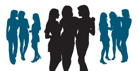 Silhouettes of  young women chatting with each other