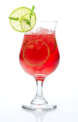red cocktail with ice and lime.
