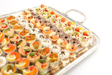 Appetizer (Canape) of shrimps and other selection food on tray