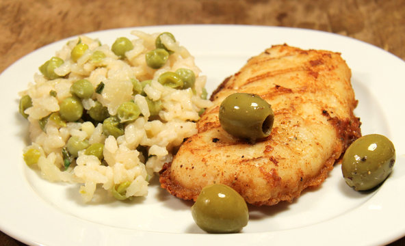 Menue mit Risotto und Seehecht