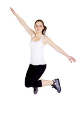 Fototapeta na wymiar Jumping fit woman. An athletic young woman is jumping. Isolated.