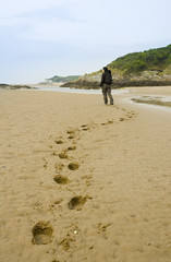 woman walking on beach