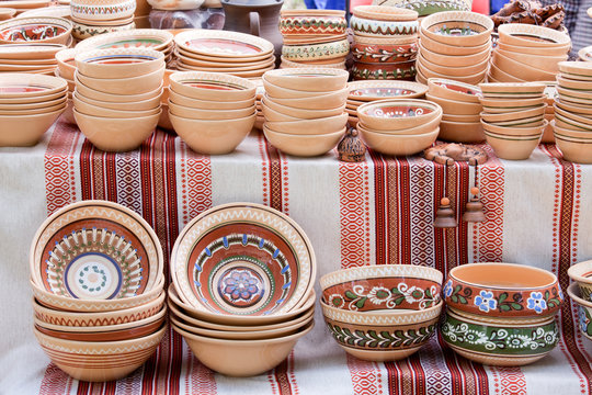 Handmade ceramics with traditional patterns at handicraft market