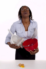 South African woman struggling in kitchen