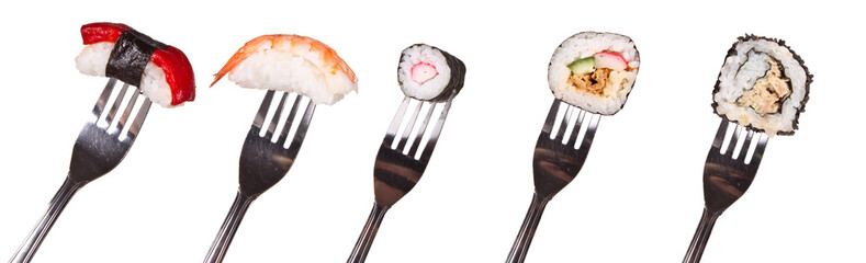 Sushi pieces on forks, isolated on white background
