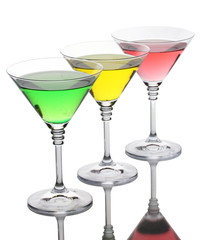 alcoholic cocktails on table isolated on white