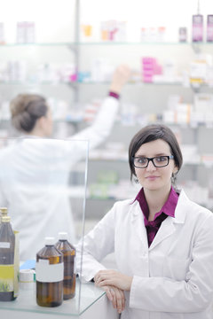team of pharmacist chemist woman  in pharmacy drugstore