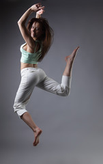 Naklejka premium beauty girl dance on grey background