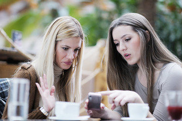 cute smiling women drinking a coffee