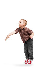 Jumping boy. A cute little boy on the move.