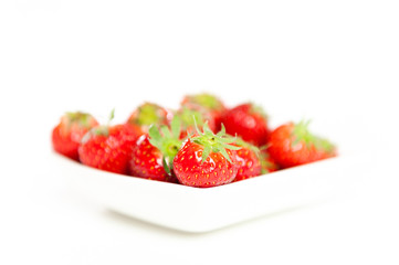 Fresh Strawberries in a bowl, isolated on white