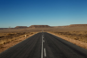 Fototapeta na wymiar paved road in the desert