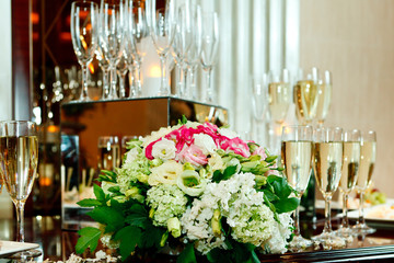 Glasses of champagne, flowers