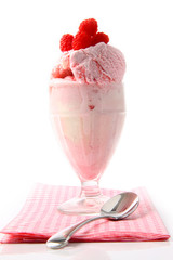Raspberry sundae with napkin on white
