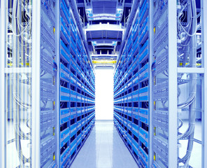 shot of network cables and servers in a technology data center