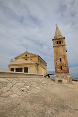 Fototapeta premium faro e chiesa di Caorle