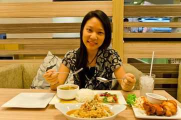 An asian (Thai) girl ready to eat her meal