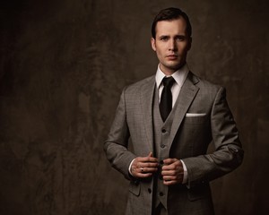 Man in grey suit.