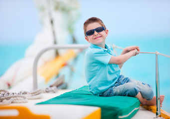 Cute boy on luxury yacht