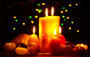 Beautiful candle and decor on wooden table on bright background